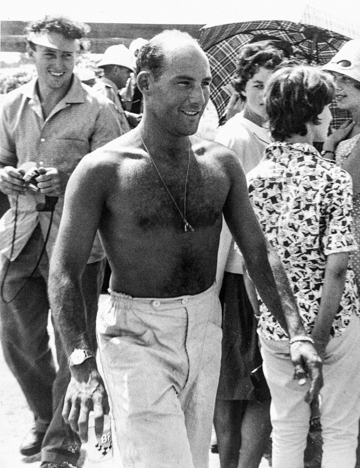 A fit and happy Stirling Moss in the pits for the 1962 Lady Wigram Trophy race at Wigram in Christchurch. He won the race in his Lotus 21 Climax (photo: Robin Curtis)